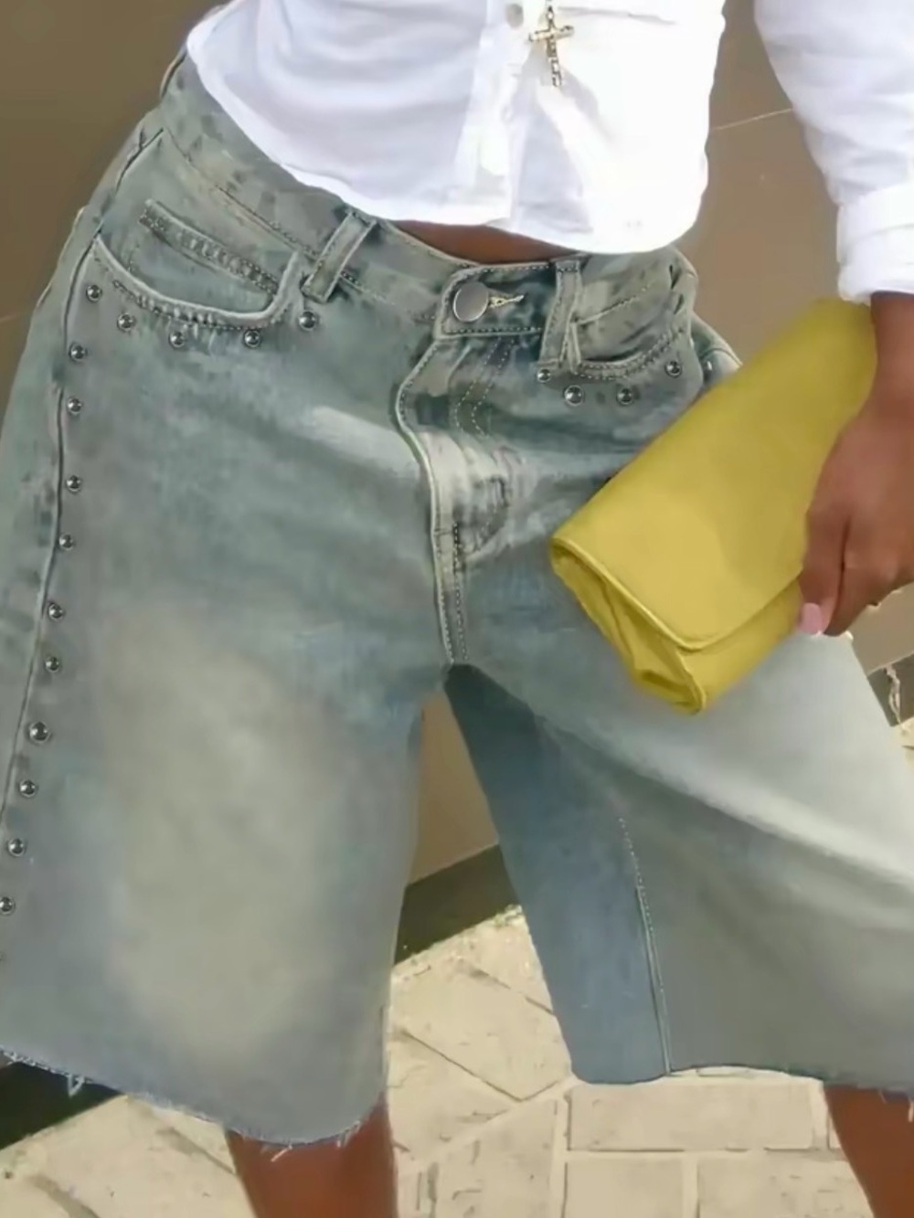 Trending vintage wash denim jorts with silver studs